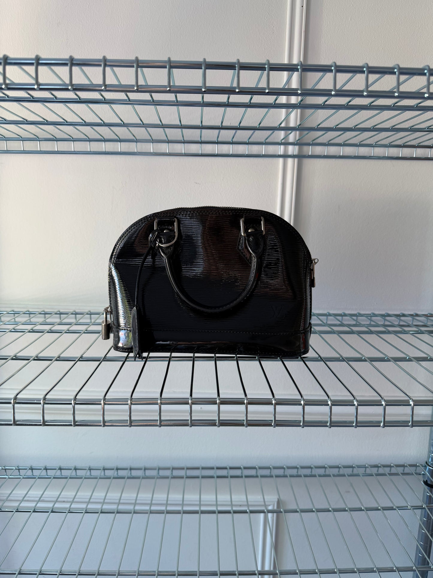 Pre-Owned Black Epi Electric Leather Alma BB Crossbody Bag